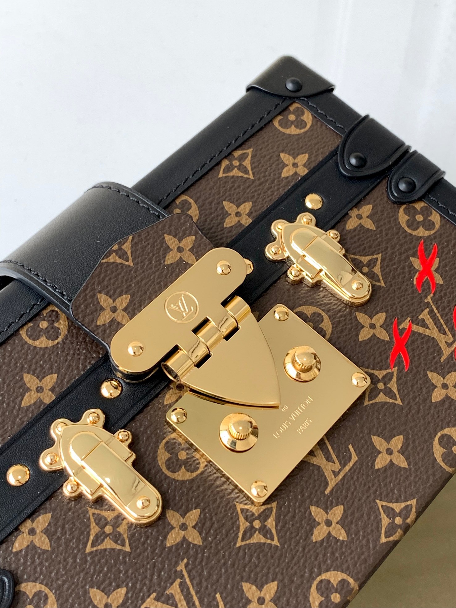 LV PETITE MALLE EAST WEST