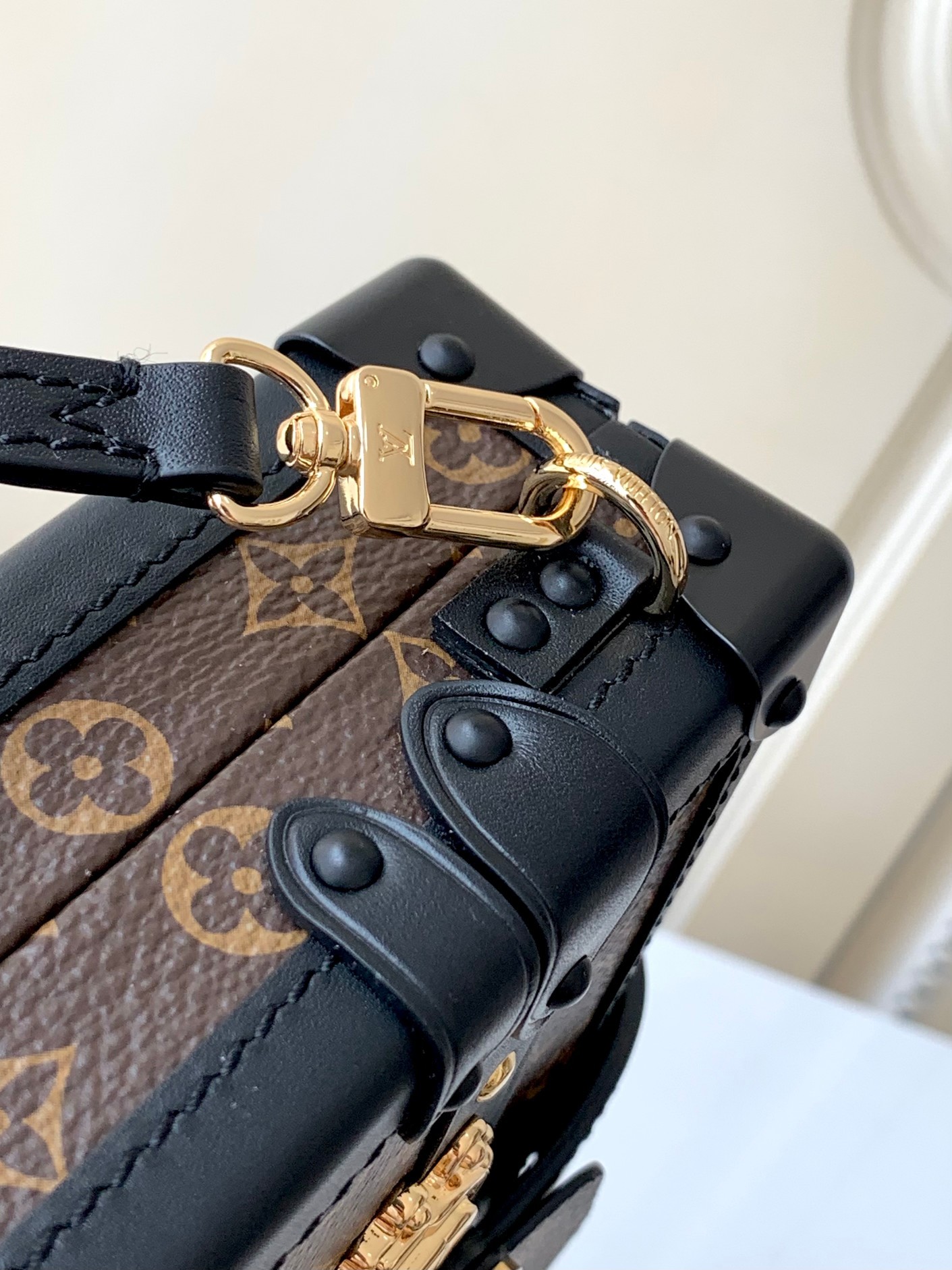 LV PETITE MALLE EAST WEST