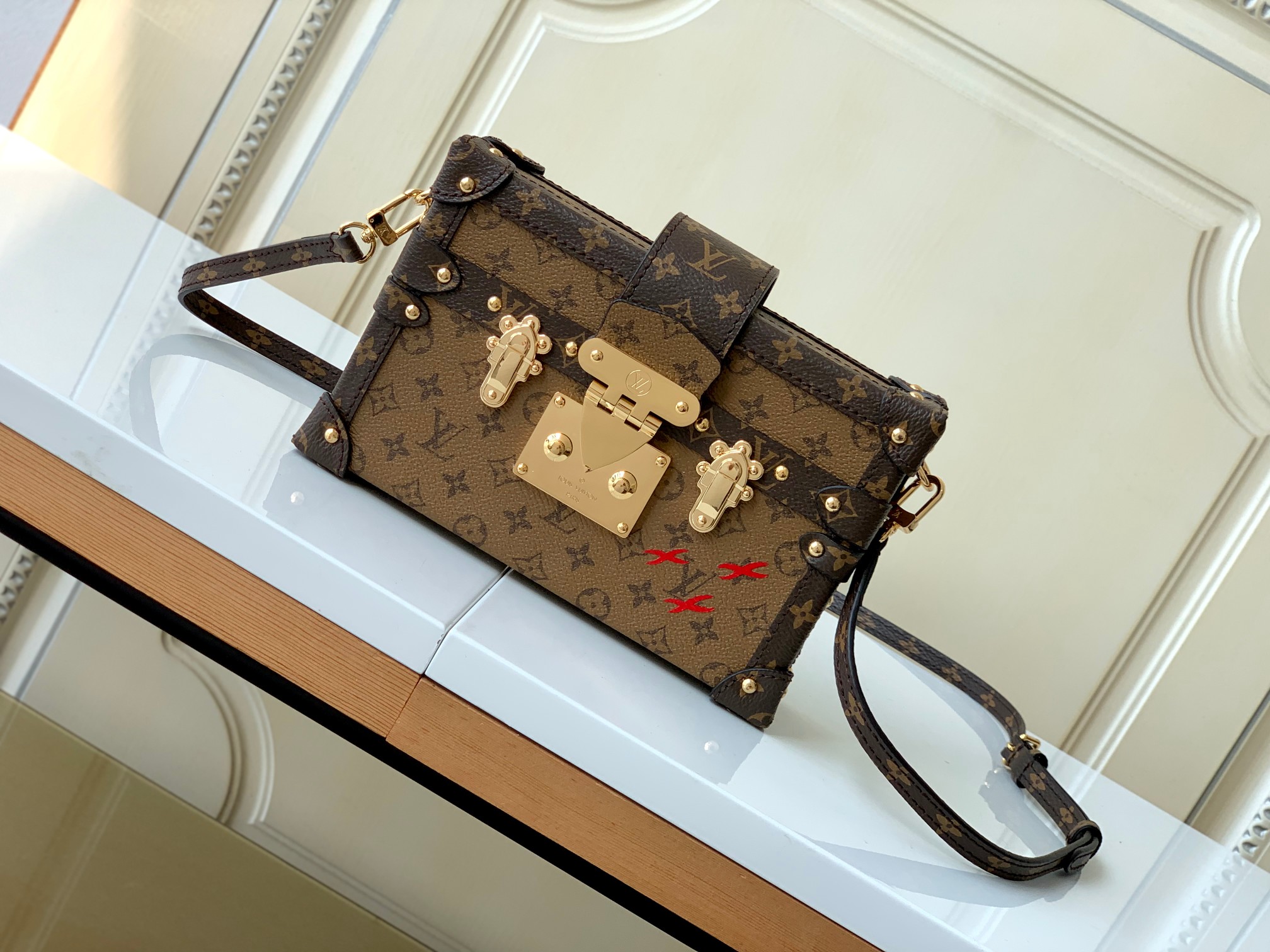 LV PETITE MALLE EAST WEST