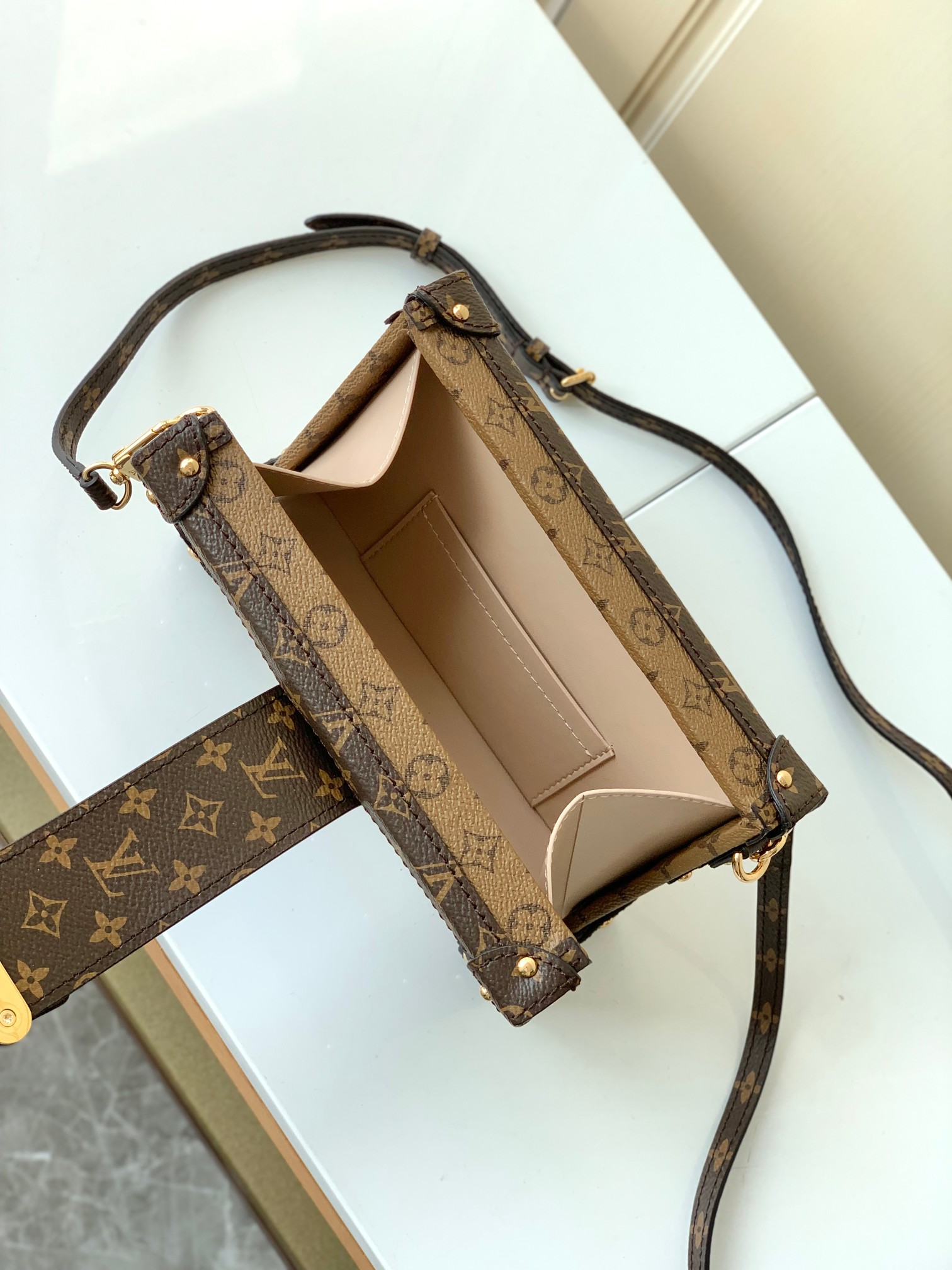 LV PETITE MALLE EAST WEST